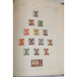 A folder album containing a collection of mint and used British Commonwealth stamps