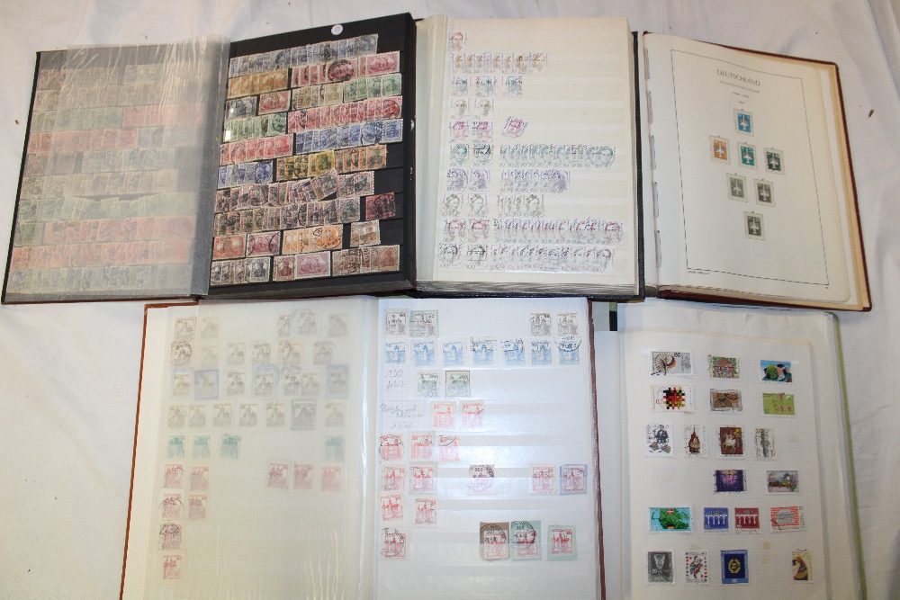 Three stock books and two folder albums containing a collection of Germany stamps