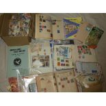 A large box containing World on/off paper stamps together with albums of stamps, stock cards etc.