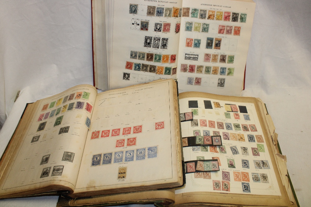 Three old albums containing a large selection of various World stamps