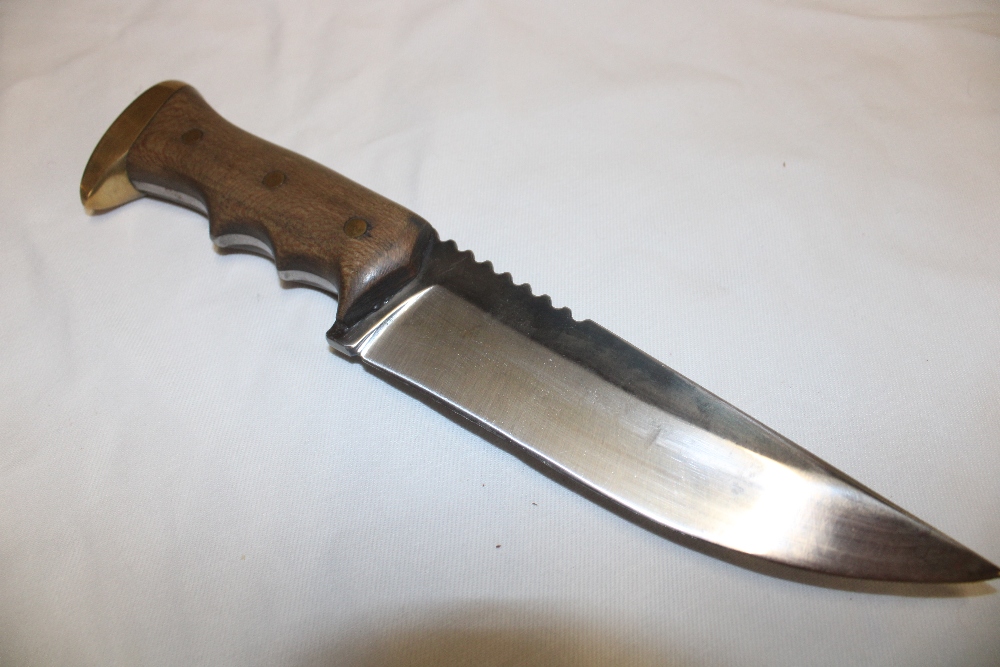 A good quality hand-crafted collector's knife with 6¼" single edged blade and cotton wood mounted