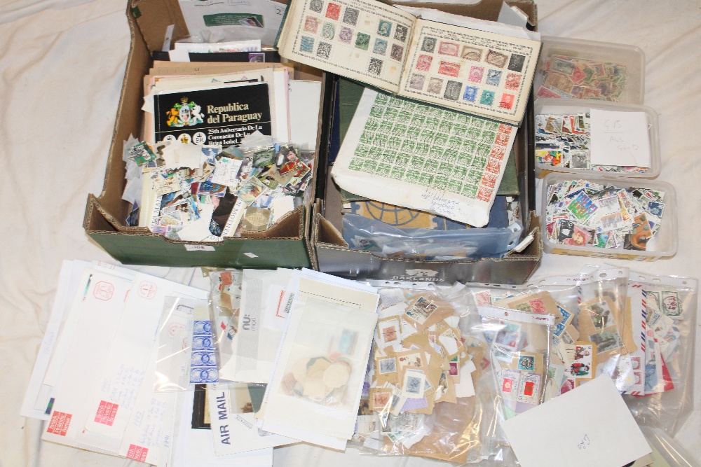 Two boxes containing various packets of World stamps, three albums of mixed World stamps,
