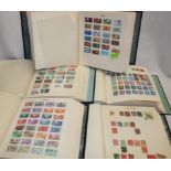 Five large boxed albums containing a large collection of World stamps A-Z