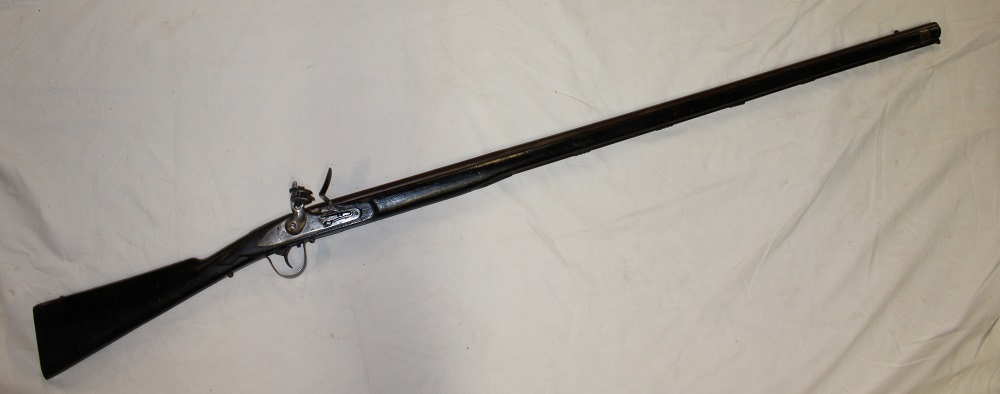 A 19th century flintlock trade gun with 44½" steel barrel,