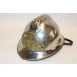 A French steel and brass mounted fire brigade helmet with leather liner and chin strap