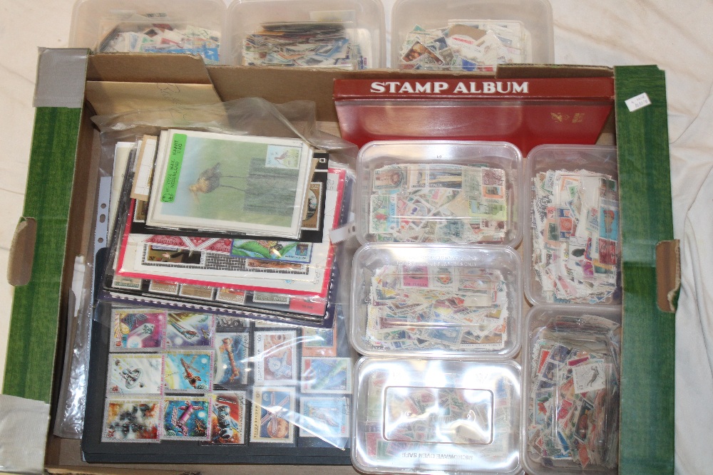 A selection of various World stamps in boxes, various album pages of World stamps, mint stamps etc.