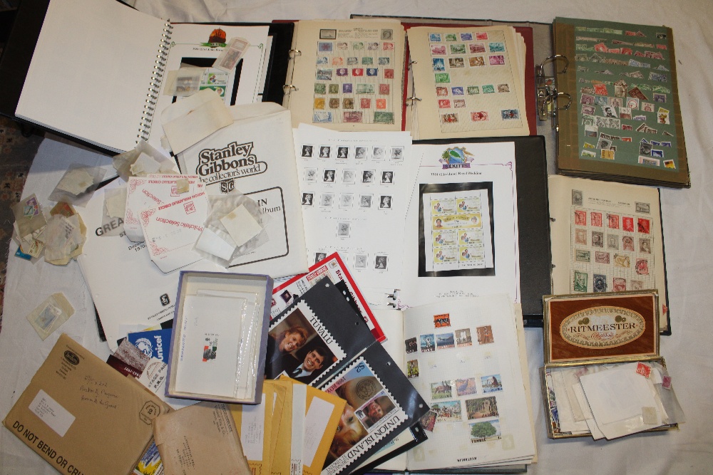 A box containing numerous albums of World stamps together with boxes of stamps, stamps in packets,