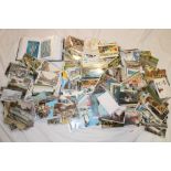 A large selection of various black and white and coloured postcards, greetings, topographical,