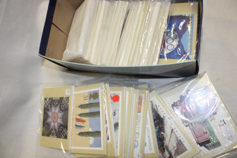 A box containing approximately 60 sets of mint PHQ cards and others,