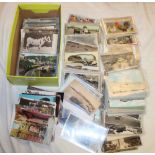 A large selection of black and white and coloured postcards including Dartmoor, Plymouth,