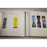 Two boxed albums containing a collection of French Eiffel Tower collectables including book matches,