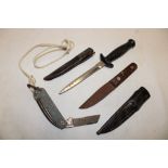 A small hunting knife with wood grips in leather sheath;