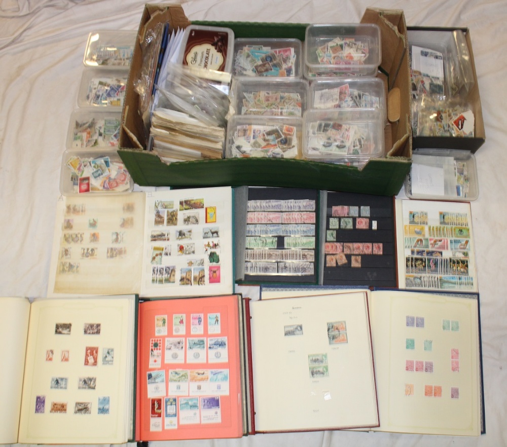 Various albums and stock books containing World stamps together with numerous boxes and packets of