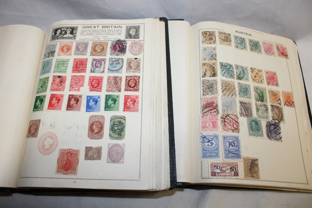 Two boxed albums containing a collection of World stamps,