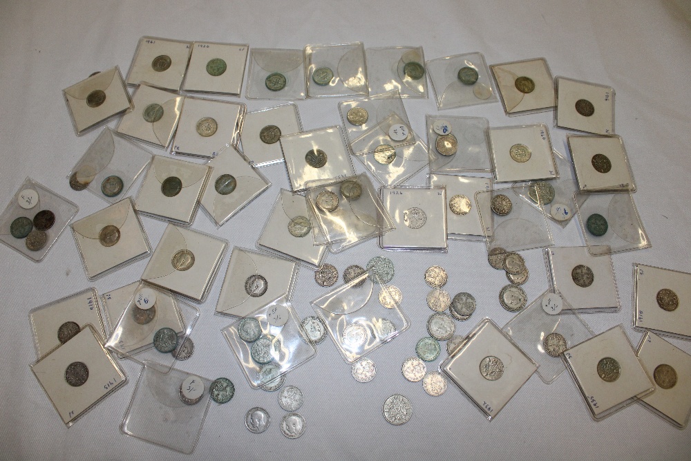 A selection of over seventy various pre-1947 silver 3d coins and seven silver 6d coins