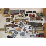 A selection of various 00 gauge kit-built layout buildings and accessories