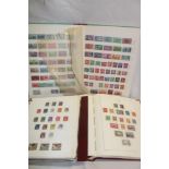 Two albums containing a collection of Canada stamps and a stock book of USA stamps