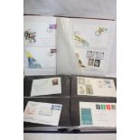 Two stock books containing a selection of GB first day covers including 1966 World Cup Final,
