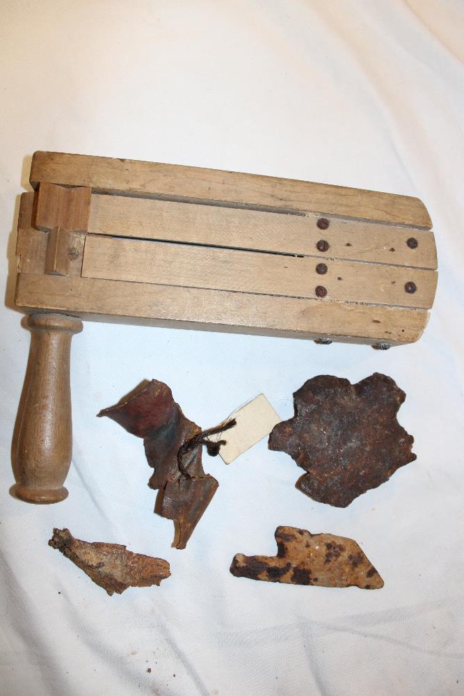 A wooden anti-gas rattle and a selection of various shrapnel pieces