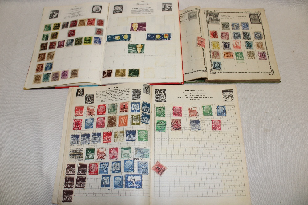 Three small albums containing World stamps