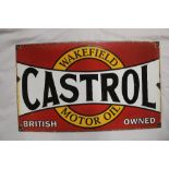 An old enamelled rectangular advertising sign "Wakefield Castrol Motor Oil - British Owned",