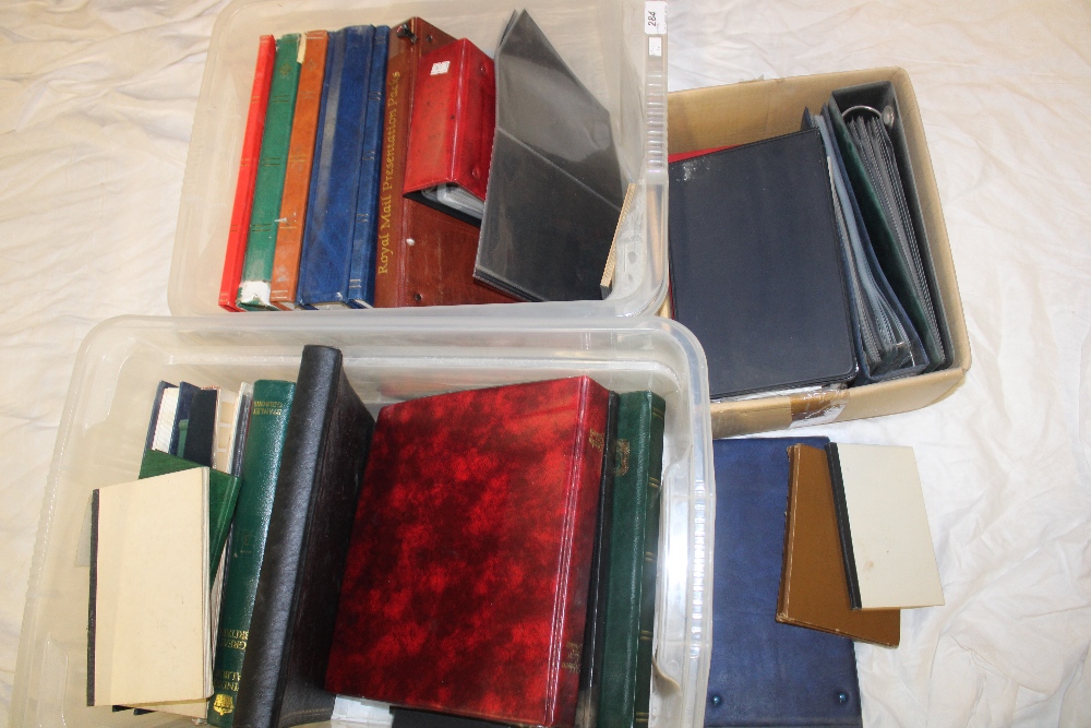 Two boxes containing a large selection of various empty stamp albums, cover albums, stock books etc.