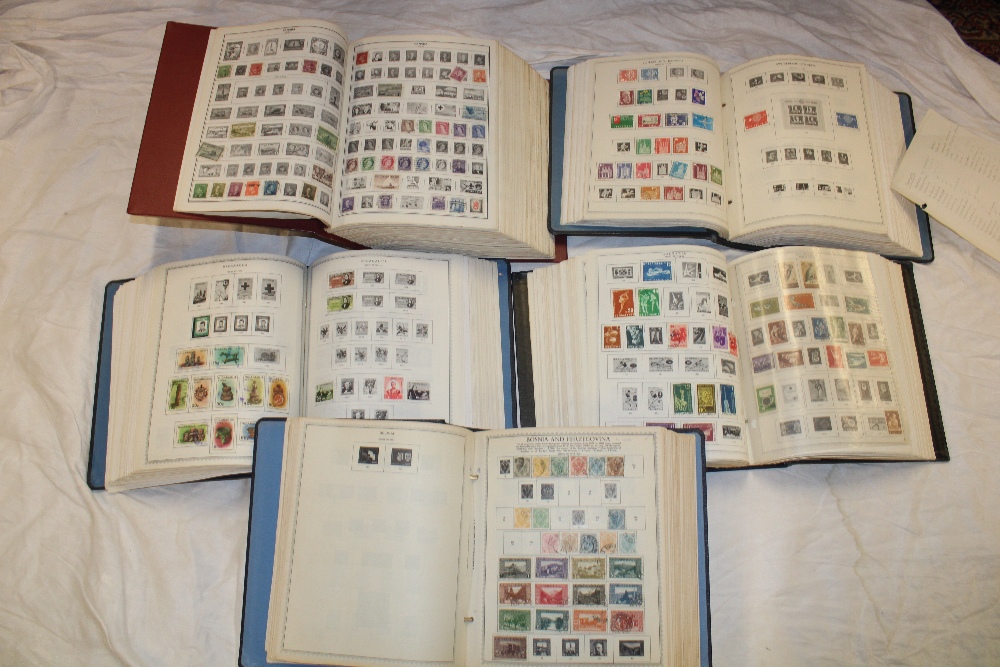 Five very large folder albums containing a large collection of World stamps
