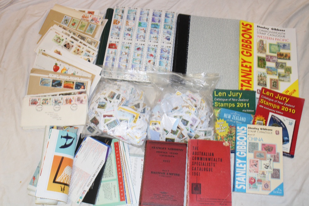 An unused Canada boxed stamp album, unused GB album, various stamp catalogues, packets of stamps,