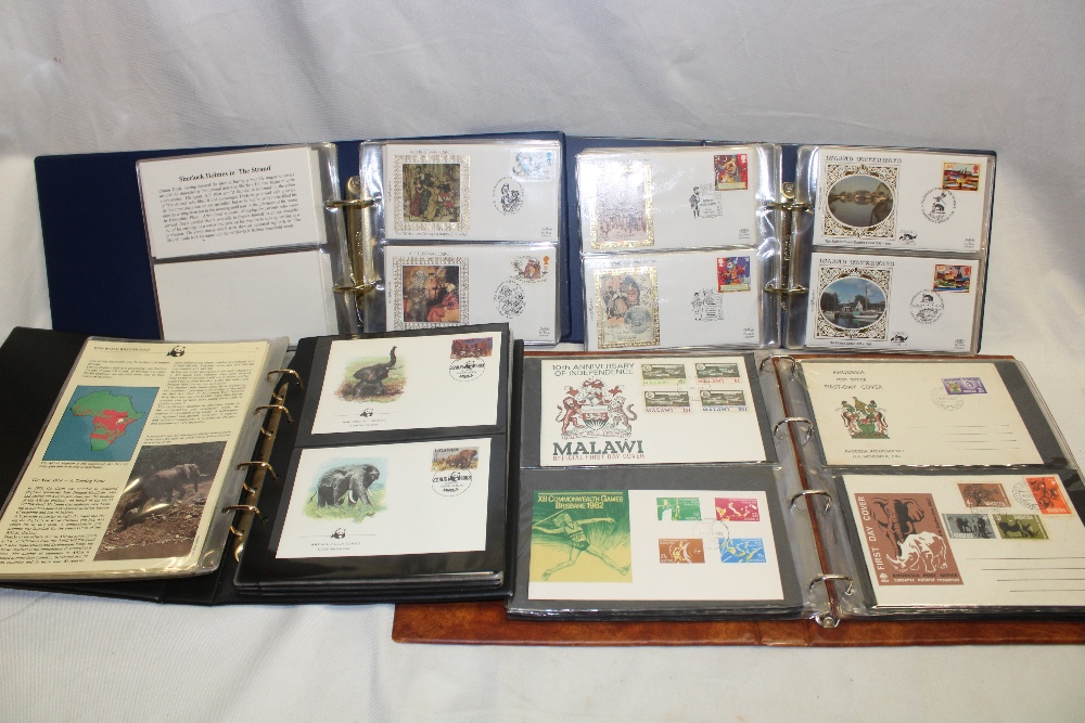 Three albums of GB first day covers and Benham silk covers and an album of World Wildlife Fund