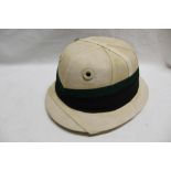 A military issue pith helmet with green/black pagri by Herbert Johnson of London