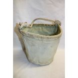 A military issue canvas collapsible bucket dated 1948 with rope handle