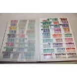 A stock book containing a collection of USA stamps 1948-1987