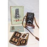 A Rolleicord Franke & Heidecke twin lens reflex camera in leather case together with instruction