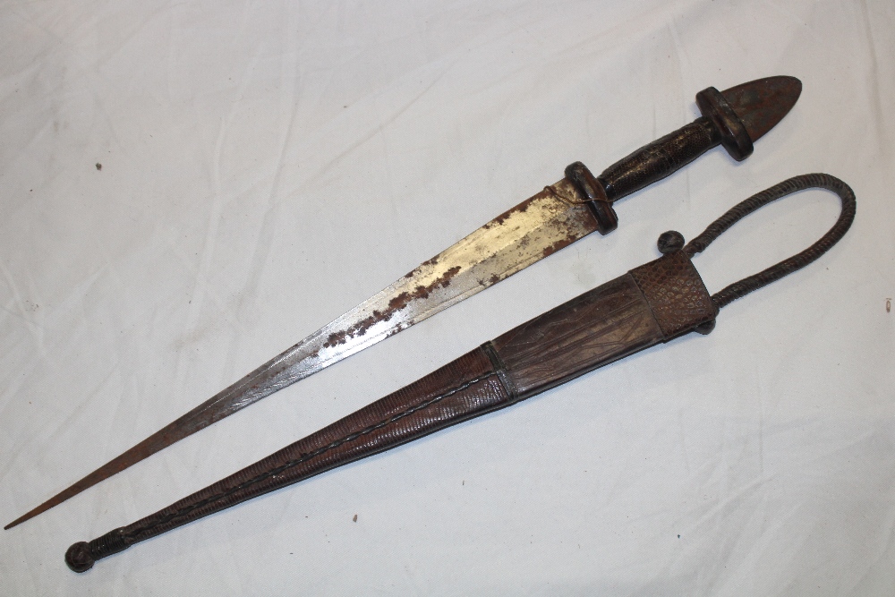 An African dagger with 16" double-edge steel blade and leather bound hilt in leather sheath