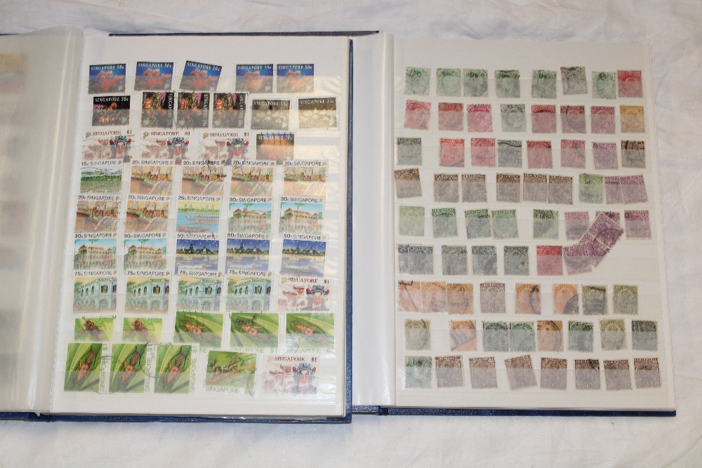 Two stock books containing a selection of British Commonwealth stamps including India, Canada,