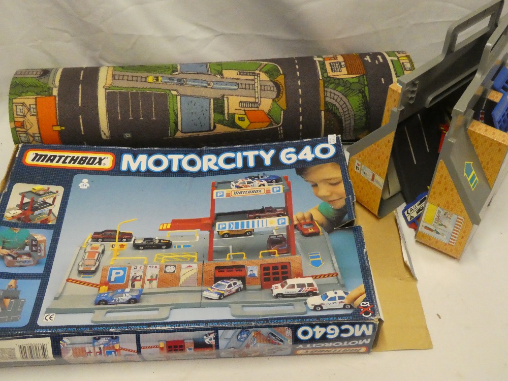 A Matchbox Motorcity G40 boxed racing car set together with street play mat etc.
