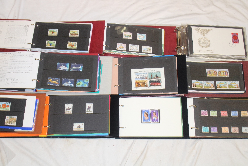 Ten albums containing a collection of Jersey and Guernsey stamp presentation packs,