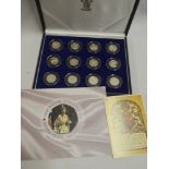 A Queen's Coronation Anniversary 1953-2003 collection of 12 silver proof 50p coins in fitted case