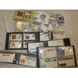 A large box containing a selection of GB covers, PHQ cards, stamps in packets,