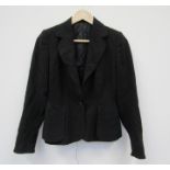 1940's war time black wool tailrored jacket which bears the rare "11011" label which means not