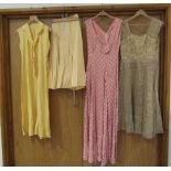 Four middle 20th Century ladies garment including a gold floral pattern organza cocktail dress