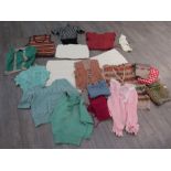 A box containing assorted mainly hand knitted jumpers and slipovers, wear to some,