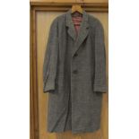 A 1950's brown check wool coat and a pair of green cord trousers