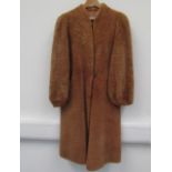 A 1940's thick lambswool coat and a fur stole