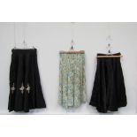 Two 1940's skirts including black taffeta with pleated stitched detail applique applied floral