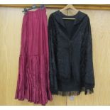 An Edwardian black silk Delhi shawl and a burgundy late Victorian full length skirt, pleated hem.