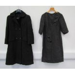 A 1960's black textured/ribbed double breasted coat, two flap front pockets,