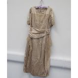 A 1910-20 oyster silk evening dress hand embroidered lace detail,
