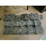 A pair of 18th Century carved oak panels of figural designs and another similar (3)