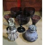 A collection of amethyst glass to include; two glass scent bottles, three large bowls,